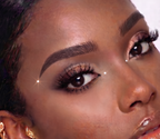 iGems™ 2mm Crystal AB face gems worn under the eye on glowing skin